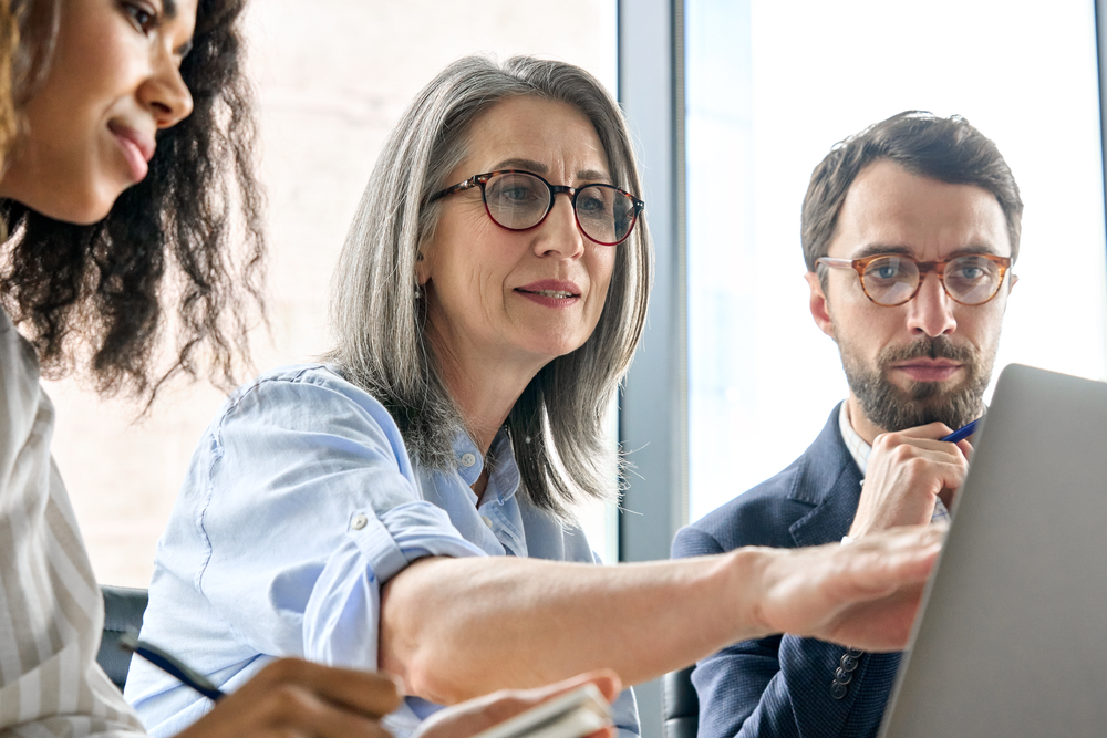 Businesswoman Mentor In Glasses Negotiating